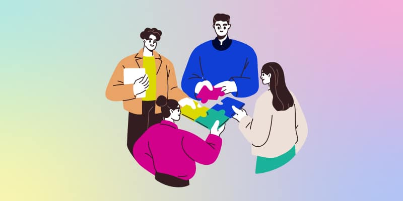 Illustration of four colleagues putting together a puzzle representing teamwork.